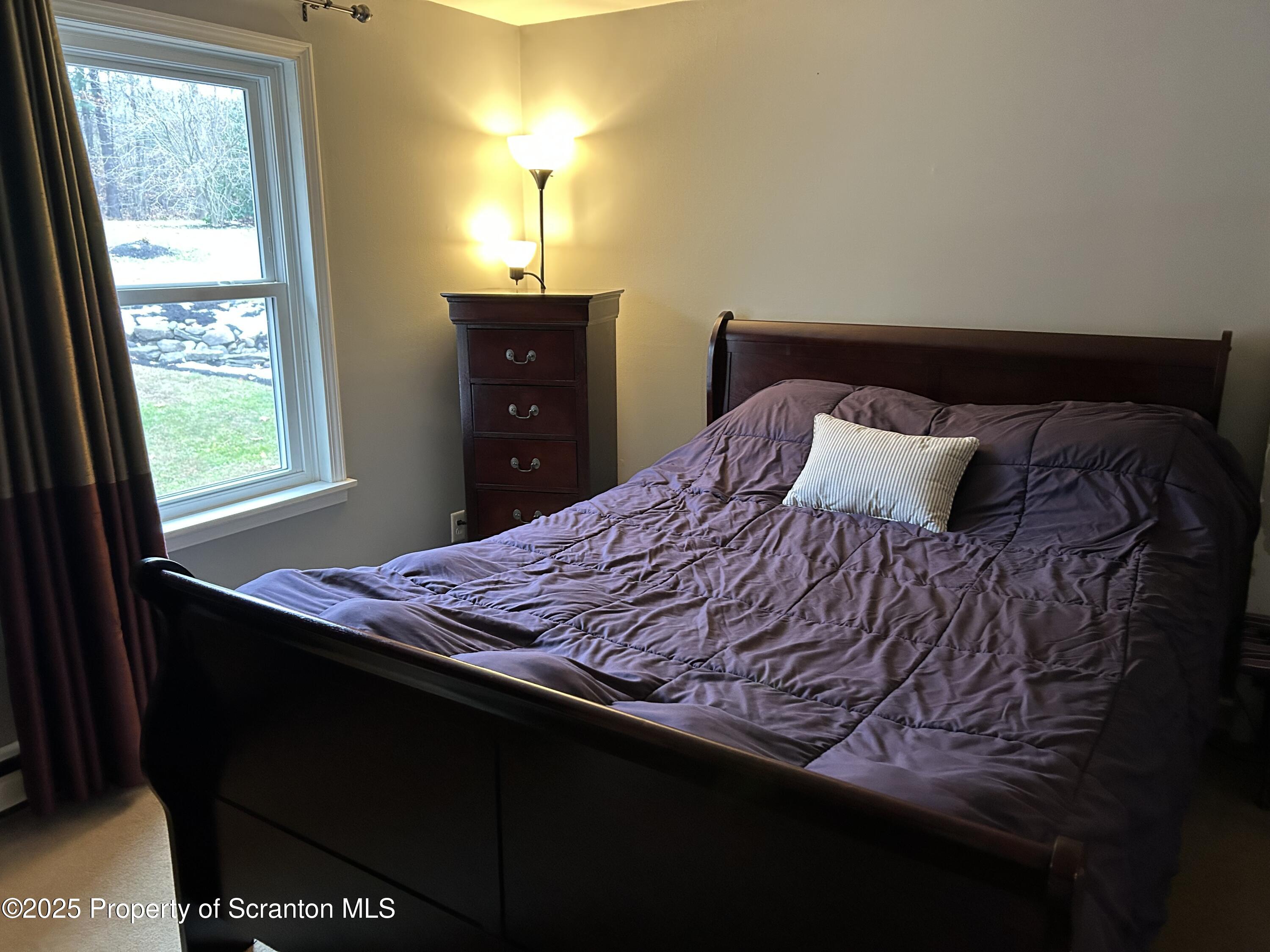7 Hollow Crest Road Tunkhannock, PA 18657 - Photo 23 of 41 a bedroom with a bed and a window