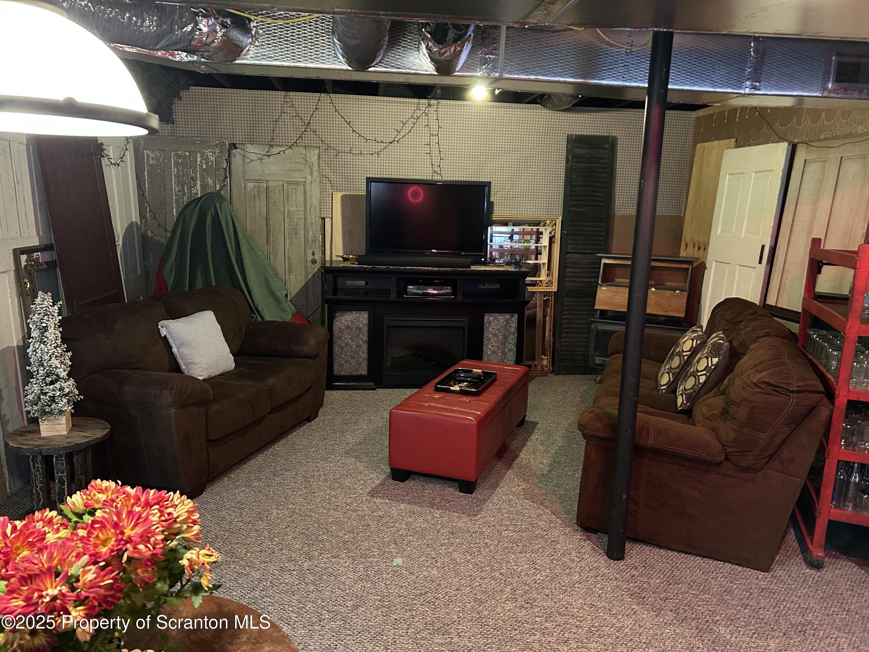 7 Hollow Crest Road Tunkhannock, PA 18657 - Photo 28 of 41 a living room with furniture and a flat screen tv