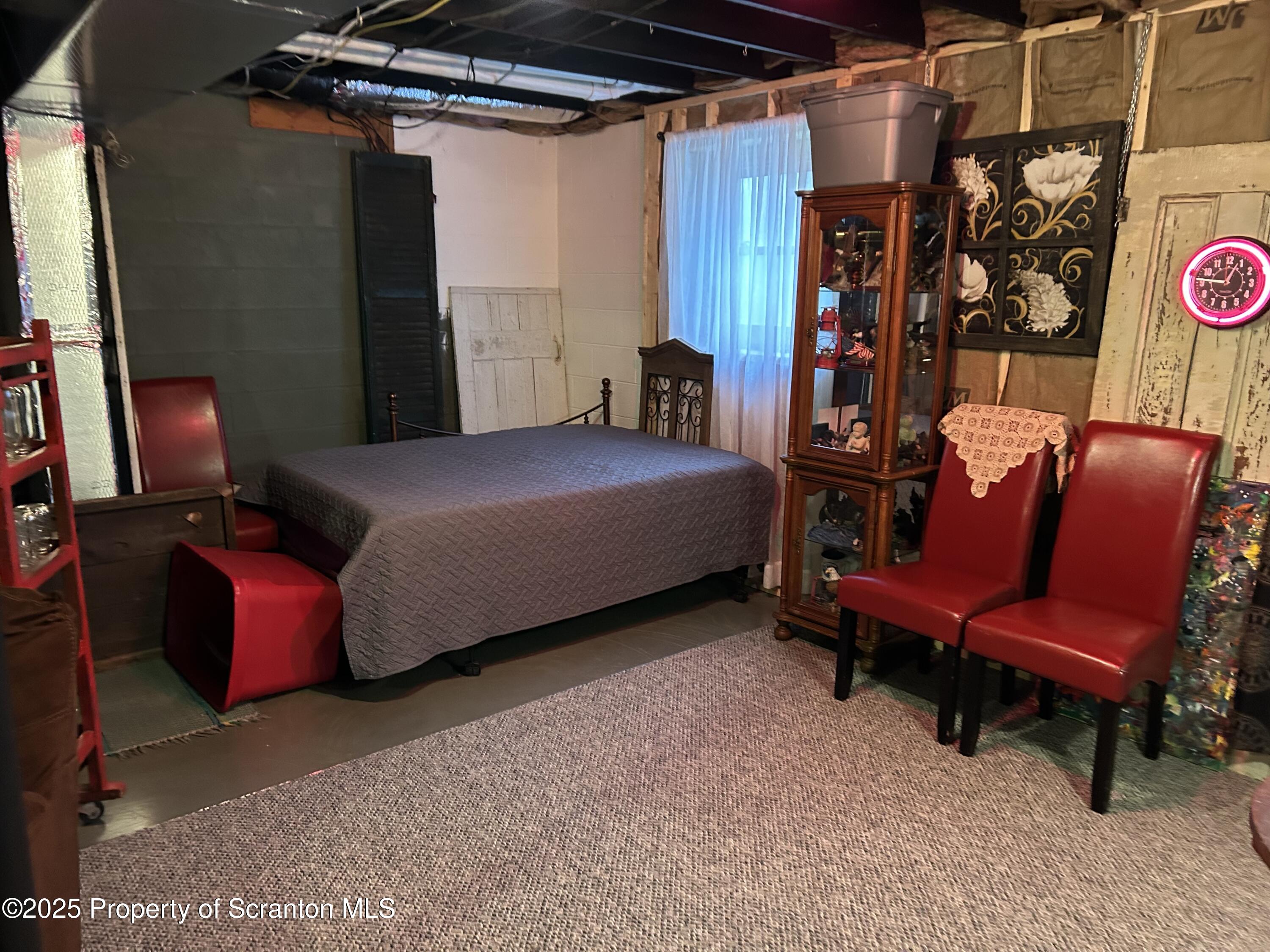 7 Hollow Crest Road Tunkhannock, PA 18657 - Photo 30 of 41 a bedroom with a bed and a chair