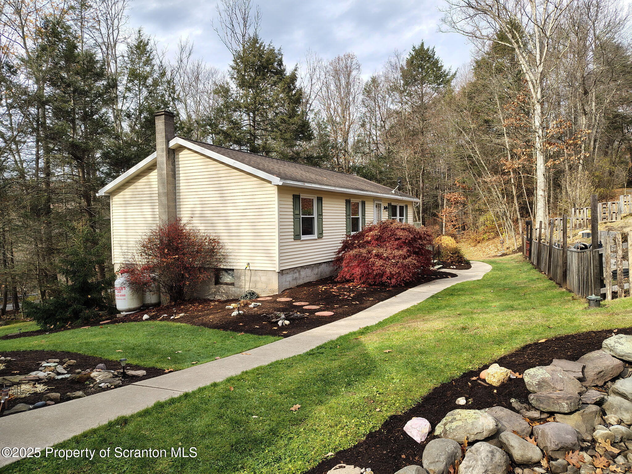 7 Hollow Crest Road Tunkhannock, PA 18657 - Photo 6 of 41 a front view of house with yard and green space