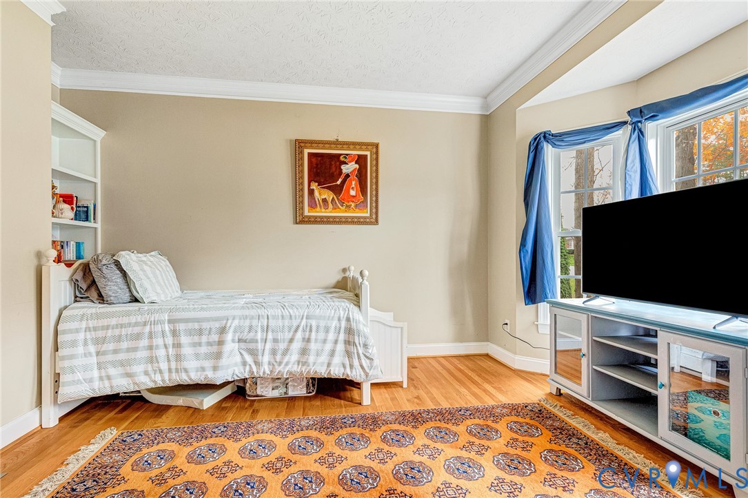9212 Wyattwood Road Mechanicsville, VA 23116 - Photo 13 of 47 a bedroom with a bed and flat screen tv