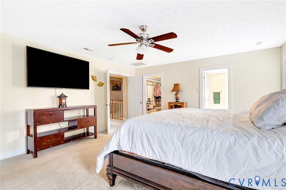 9212 Wyattwood Road Mechanicsville, VA 23116 - Photo 17 of 47 a bedroom with a bed and a flat screen tv