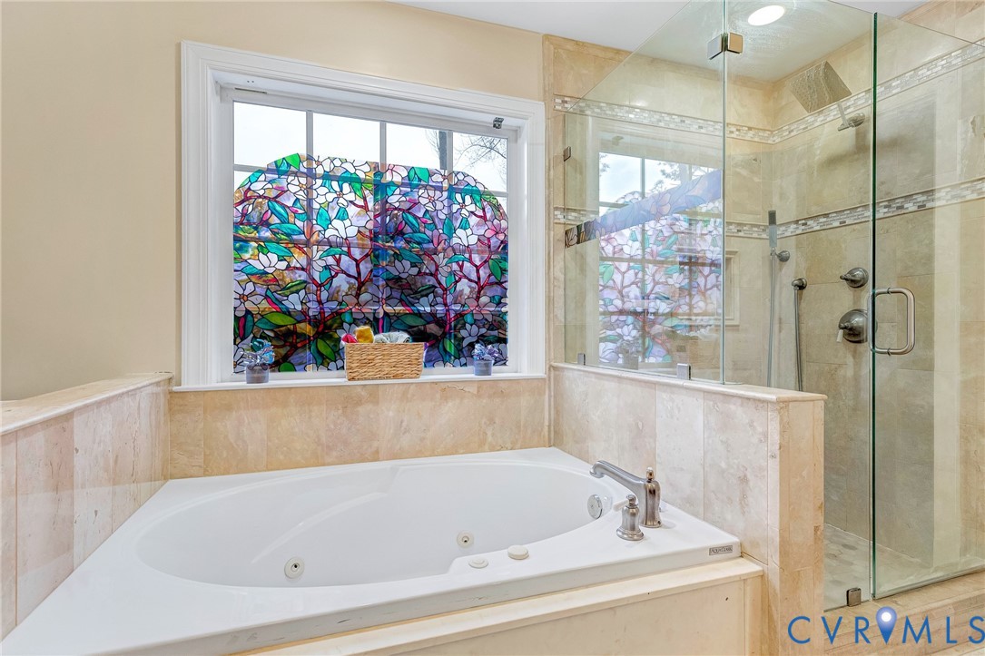 9212 Wyattwood Road Mechanicsville, VA 23116 - Photo 18 of 47 a bathroom with a bathtub and a shower