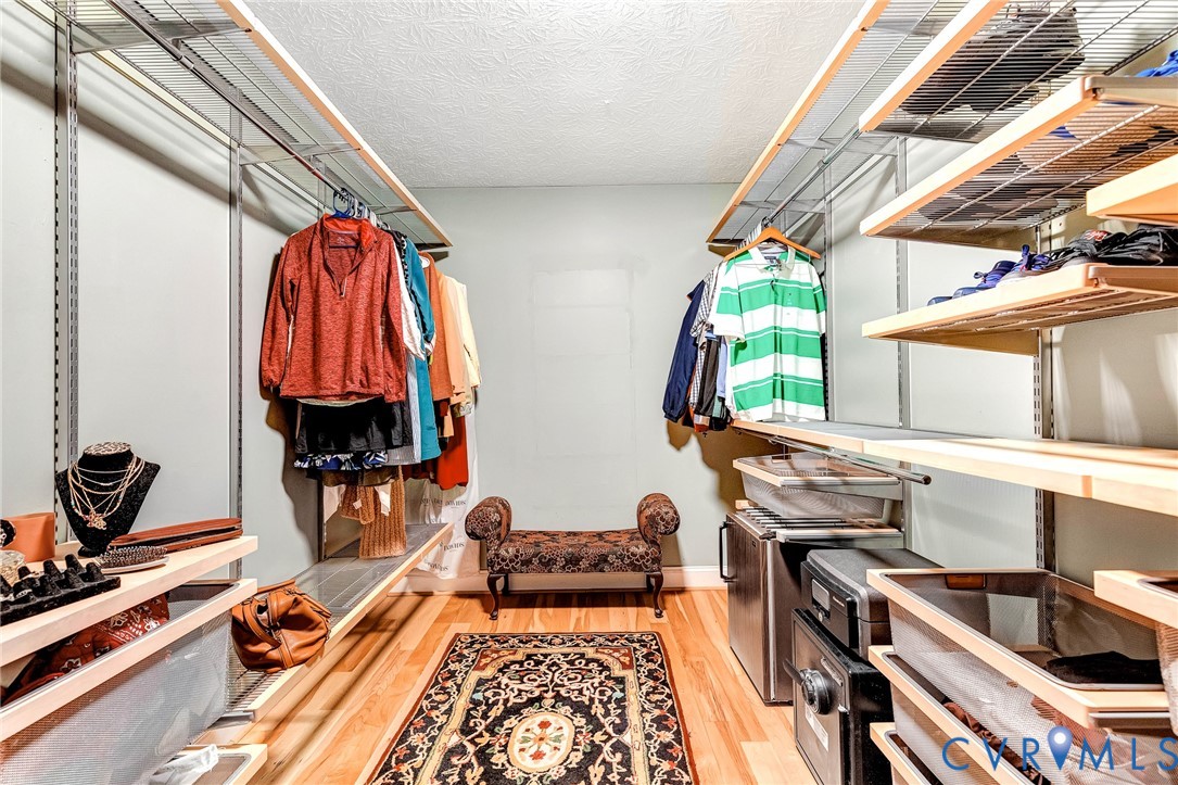 9212 Wyattwood Road Mechanicsville, VA 23116 - Photo 20 of 47 a view of walk in closet with clothes and shoes