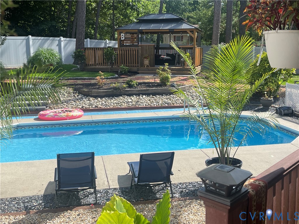 9212 Wyattwood Road Mechanicsville, VA 23116 - Photo 2 of 47 a view of a house with backyard porch and sitting area