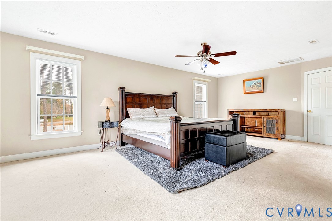 9212 Wyattwood Road Mechanicsville, VA 23116 - Photo 21 of 47 a bedroom with a bed couch and window