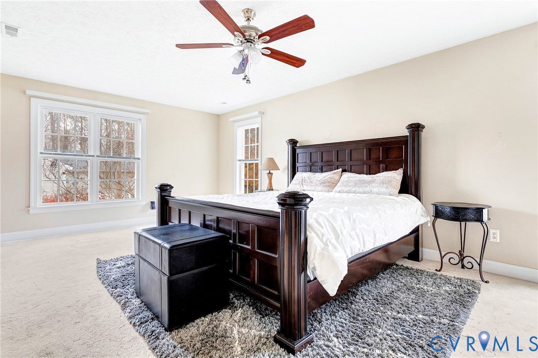 9212 Wyattwood Road Mechanicsville, VA 23116 - Photo 22 of 47 a bedroom with a bed a window and couch