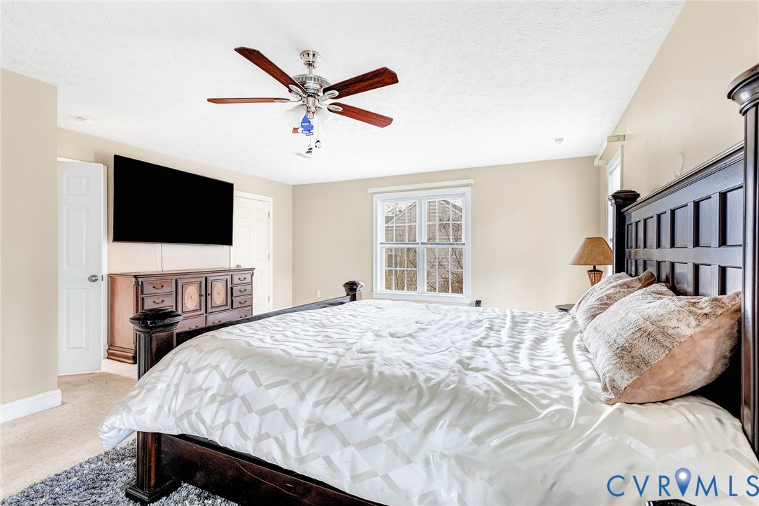 9212 Wyattwood Road Mechanicsville, VA 23116 - Photo 23 of 47 a bedroom with a bed and a flat screen tv