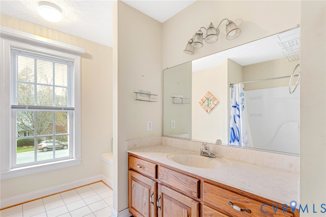 9212 Wyattwood Road Mechanicsville, VA 23116 - Photo 25 of 47 a bathroom with a sink and a mirror