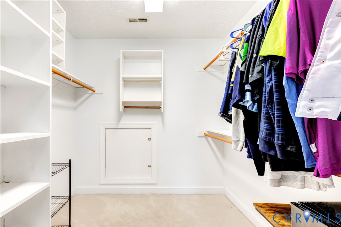 9212 Wyattwood Road Mechanicsville, VA 23116 - Photo 26 of 47 a view of walk in closet with clothes and shoes
