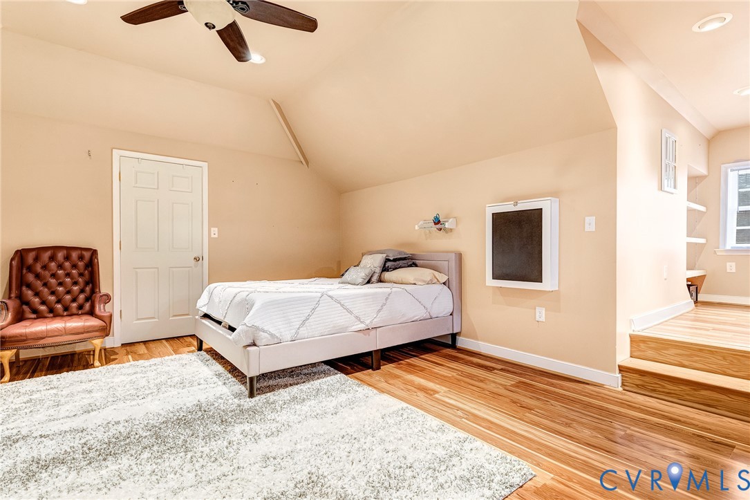 9212 Wyattwood Road Mechanicsville, VA 23116 - Photo 30 of 47 a bedroom with a bed and a couch