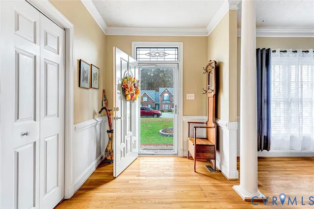 a view of livingroom with furniture window and front door