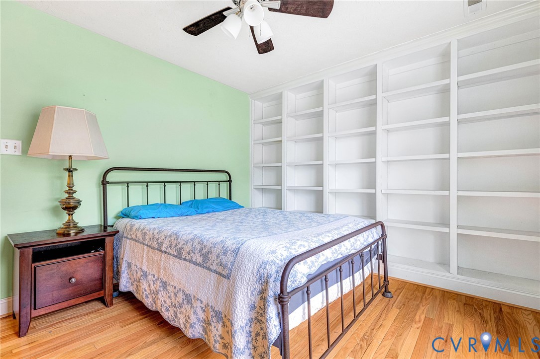 9212 Wyattwood Road Mechanicsville, VA 23116 - Photo 33 of 47 a bedroom with a bed and a night stand