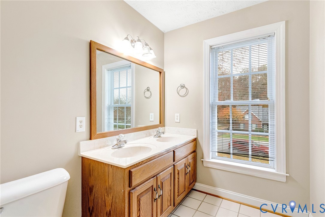 9212 Wyattwood Road Mechanicsville, VA 23116 - Photo 36 of 47 a bathroom with a sink and a toilet