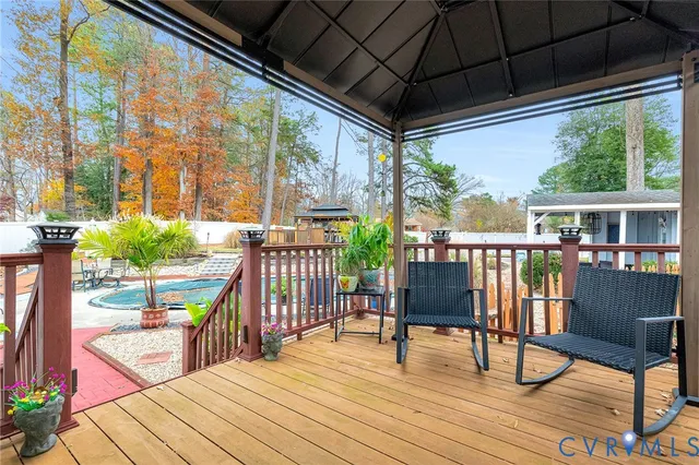 a bath room with a sink and wooden floor