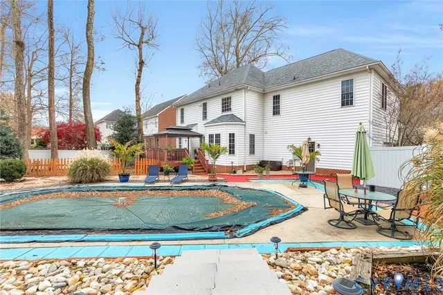 a view of a swimming pool with a sitting area