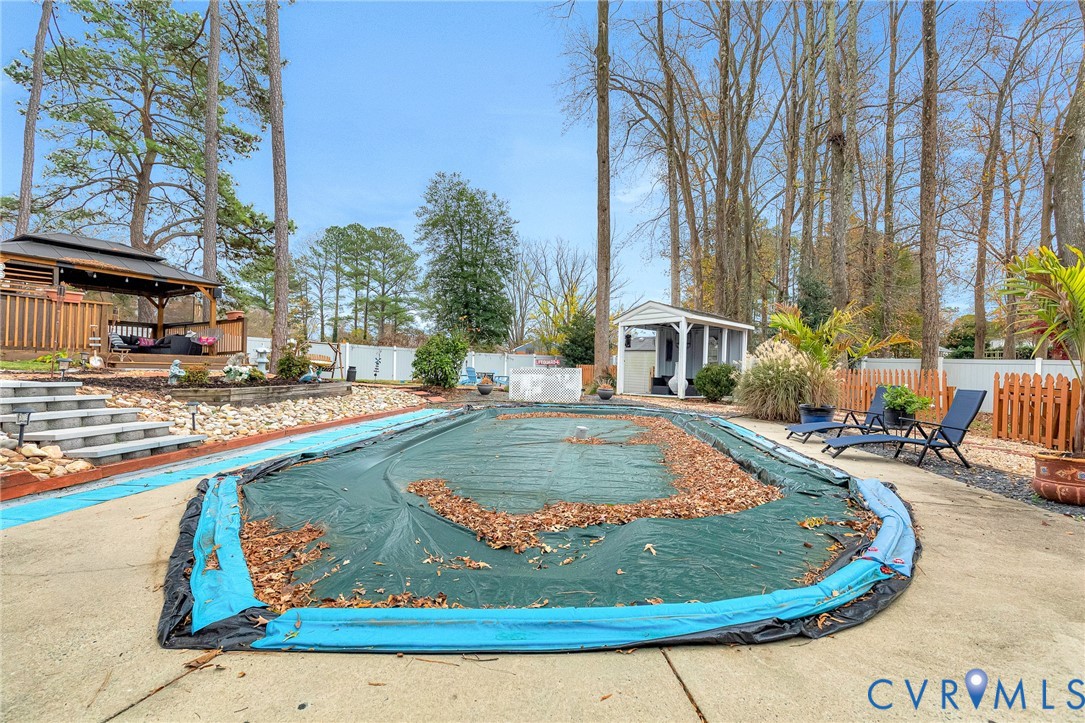 9212 Wyattwood Road Mechanicsville, VA 23116 - Photo 42 of 47 a view of a swimming pool with a sitting area