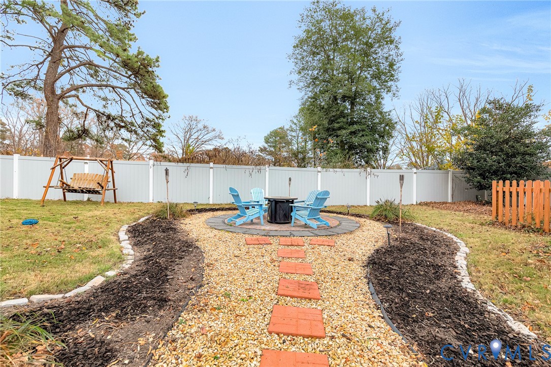 9212 Wyattwood Road Mechanicsville, VA 23116 - Photo 43 of 47 a view of a yard with plants and a tree