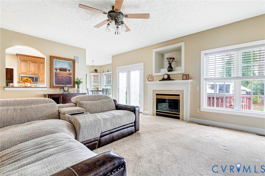 9212 Wyattwood Road Mechanicsville, VA 23116 - Photo 10 of 47 a living room with couches and a fireplace