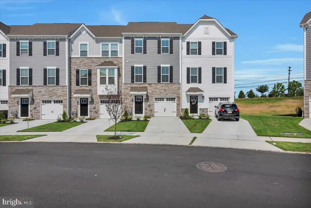 a view of multiple houses with a yard
