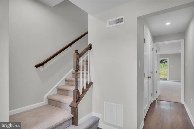a view of a hallway with staircase