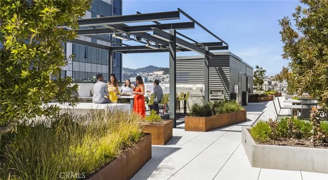 a view of a living room and kitchen with furniture