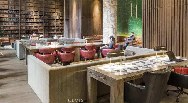 a media room with lots of chairs and mirrors