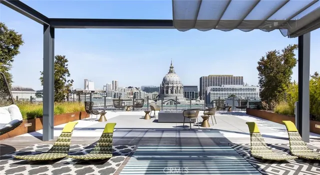 a view of a chairs and table in the patio