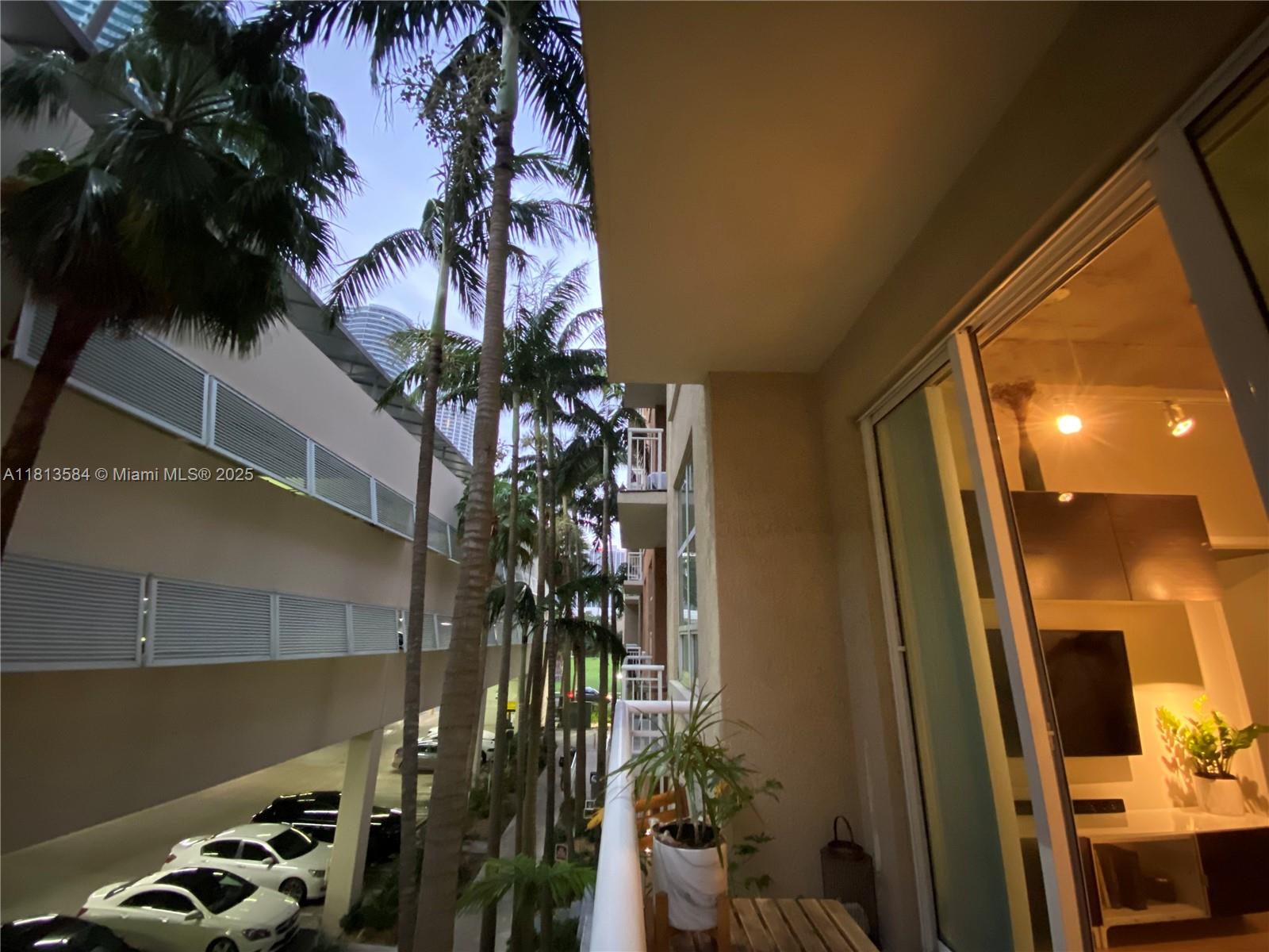 2001 Biscayne Boulevard, Unit 3203 Miami, FL 33137 - Photo 12 of 15 a potted plant sitting in front of a house