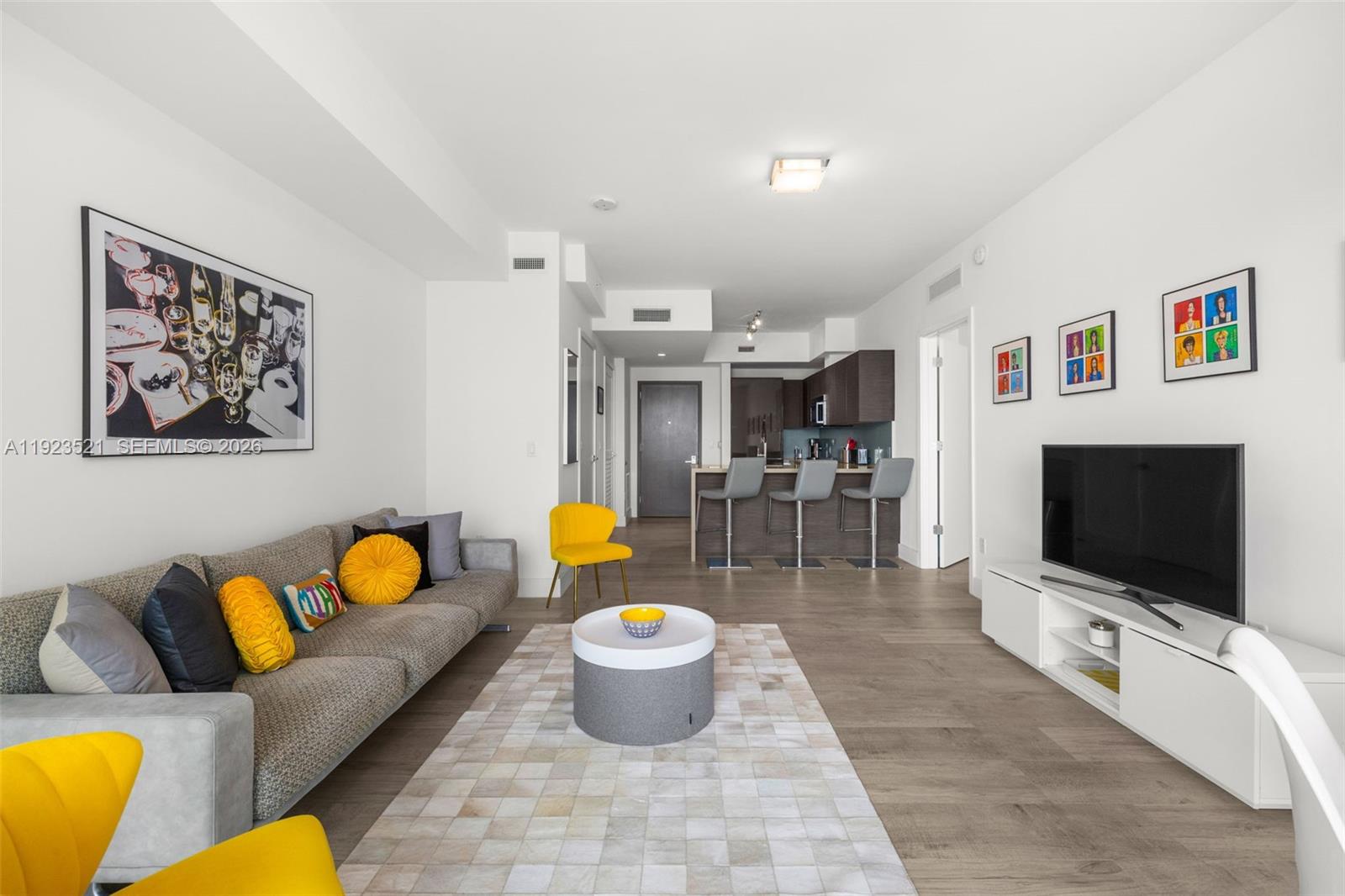 1080 Brickell Avenue, Unit 3602 Miami, FL 33131 - Photo 12 of 45 a living room with furniture and a flat screen tv