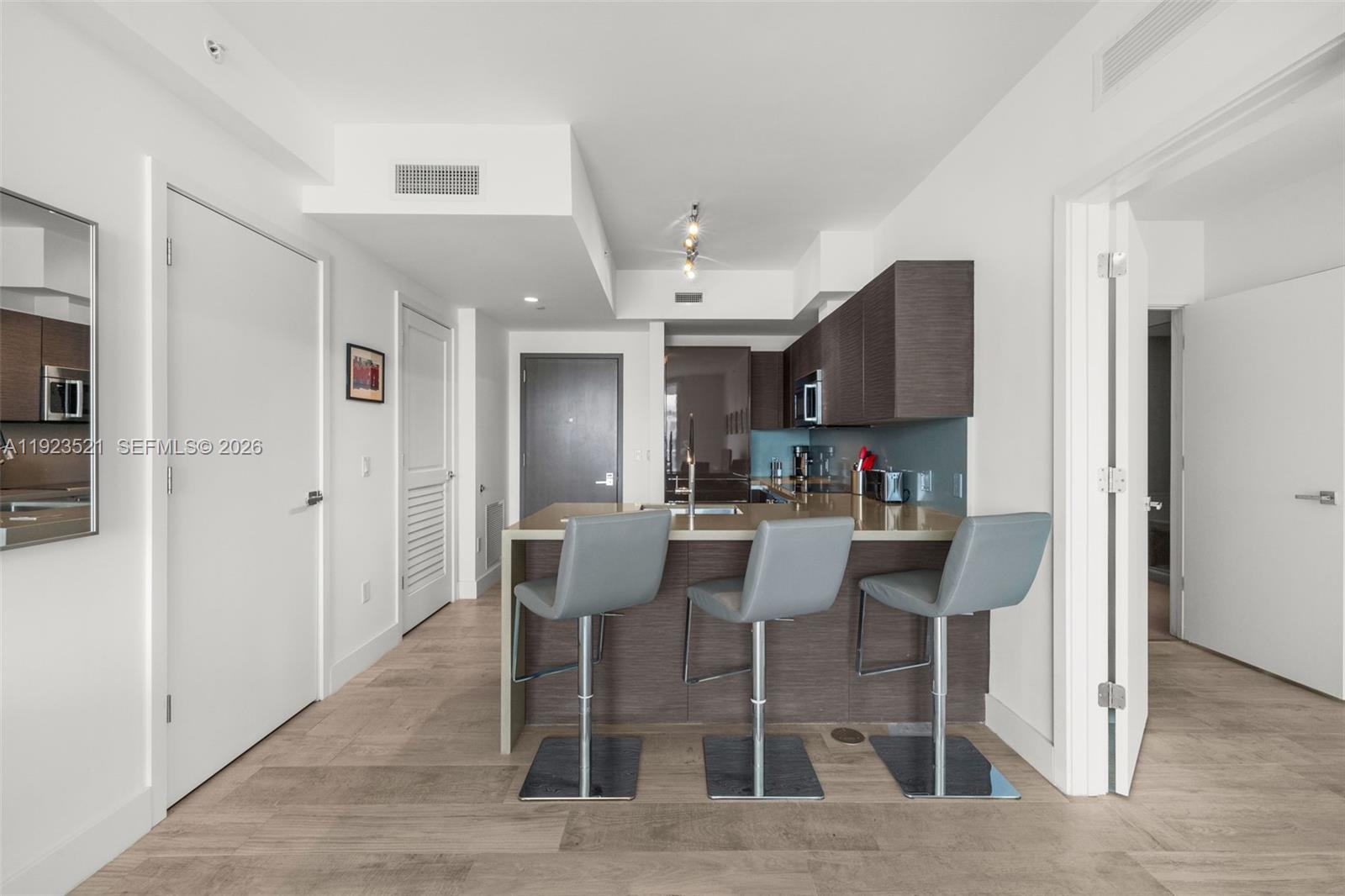 1080 Brickell Avenue, Unit 3602 Miami, FL 33131 - Photo 14 of 45 a view of a dining room with furniture