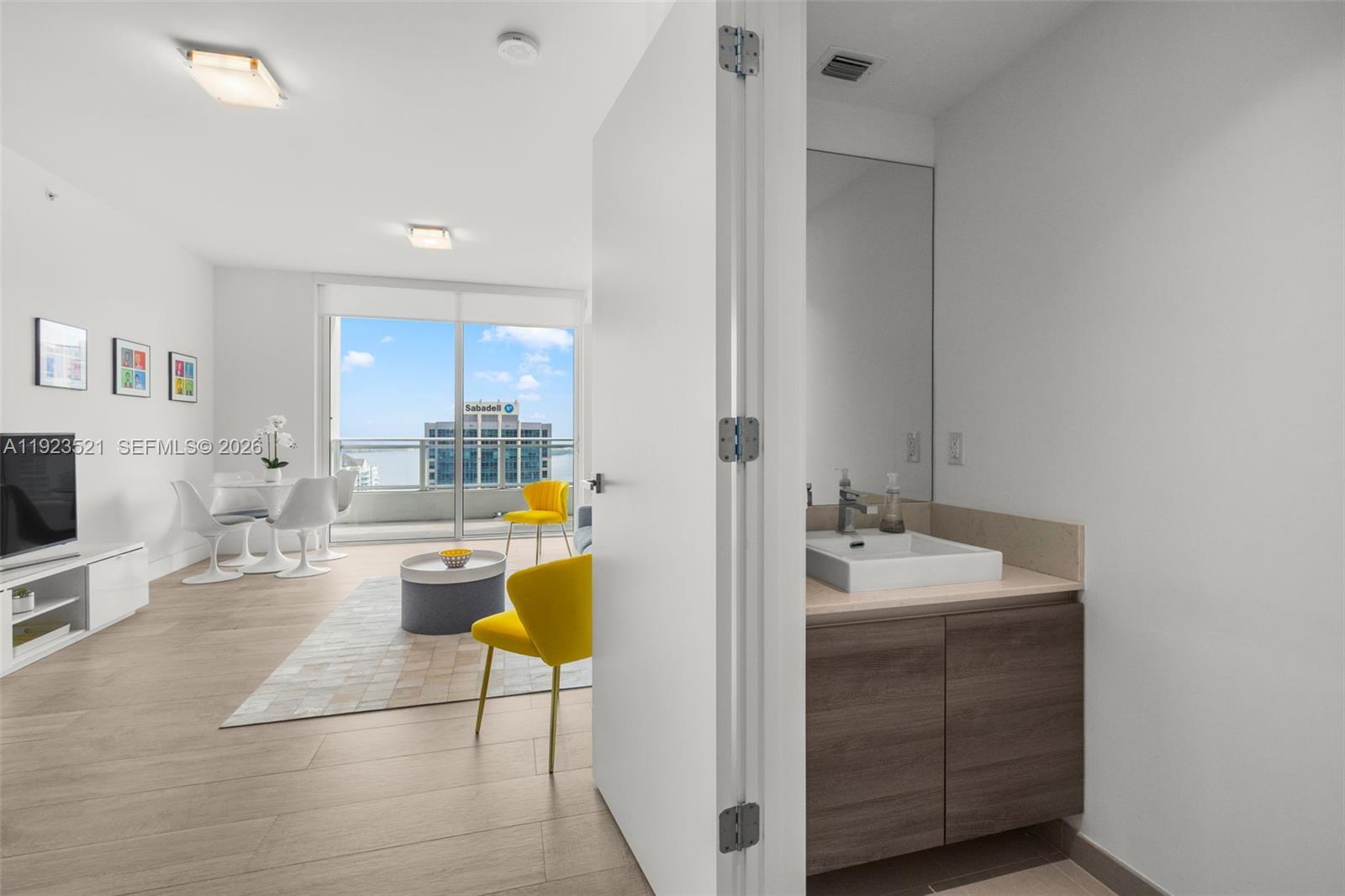 1080 Brickell Avenue, Unit 3602 Miami, FL 33131 - Photo 20 of 45 a spacious bathroom with a sink a bathtub and next to the window