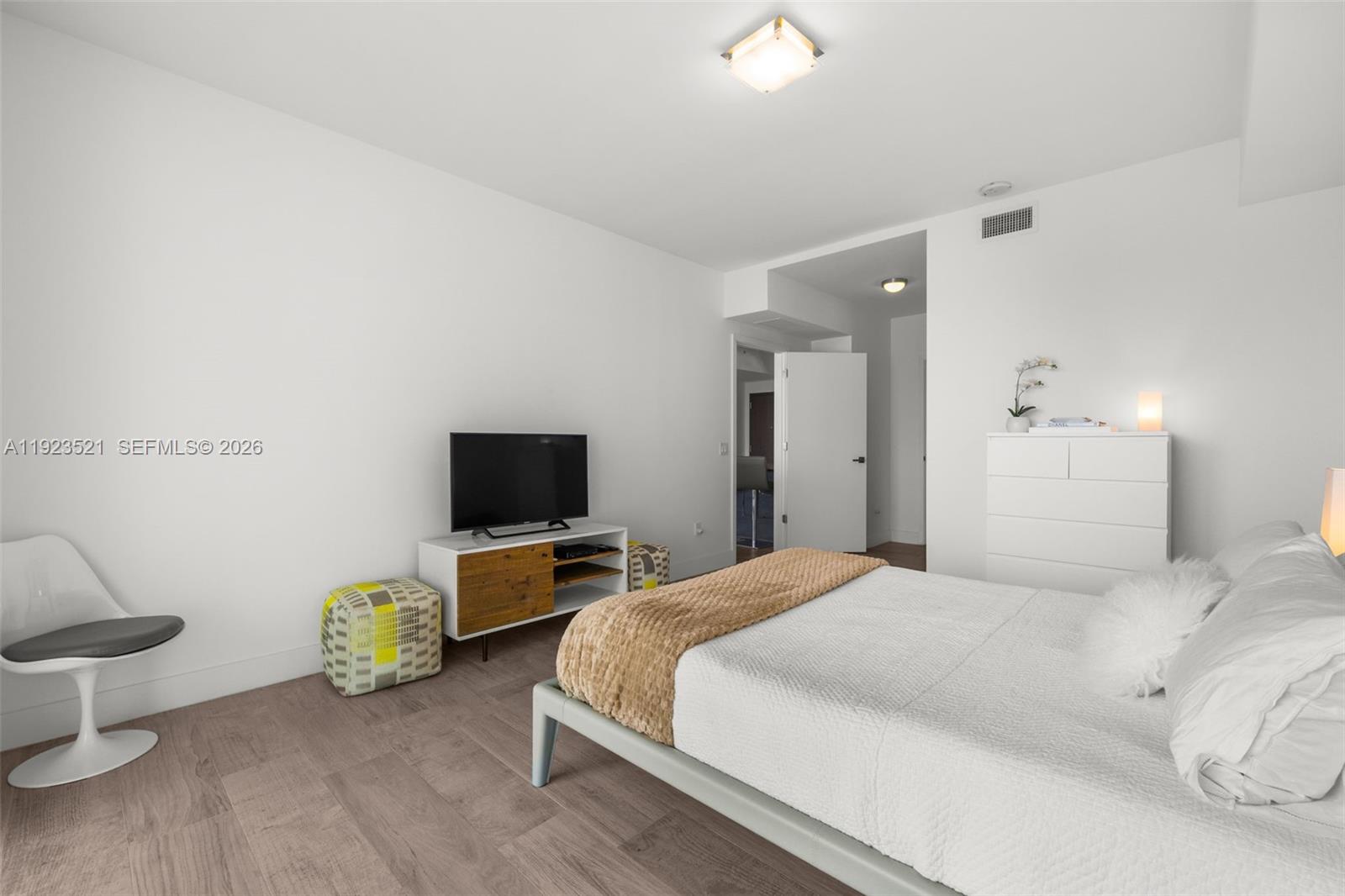 1080 Brickell Avenue, Unit 3602 Miami, FL 33131 - Photo 27 of 45 a bedroom with bed and table