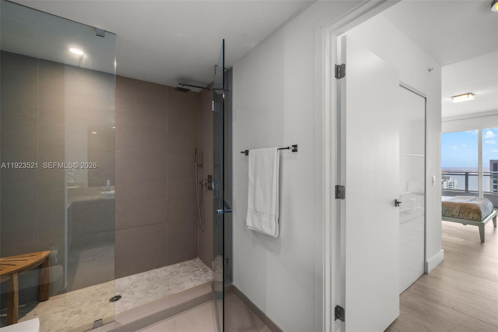 1080 Brickell Avenue, Unit 3602 Miami, FL 33131 - Photo 32 of 45 a bathroom with a shower and a sink
