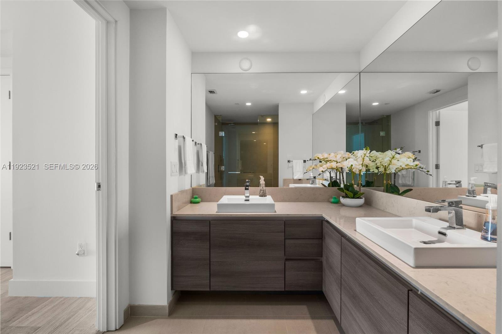 1080 Brickell Avenue, Unit 3602 Miami, FL 33131 - Photo 33 of 45 a bathroom with a double vanity sink and a mirror