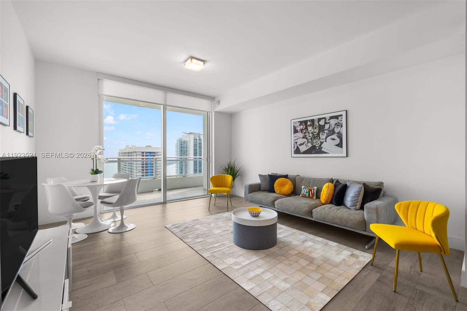 1080 Brickell Avenue, Unit 3602 Miami, FL 33131 - Photo 4 of 45 a living room with furniture and a couch
