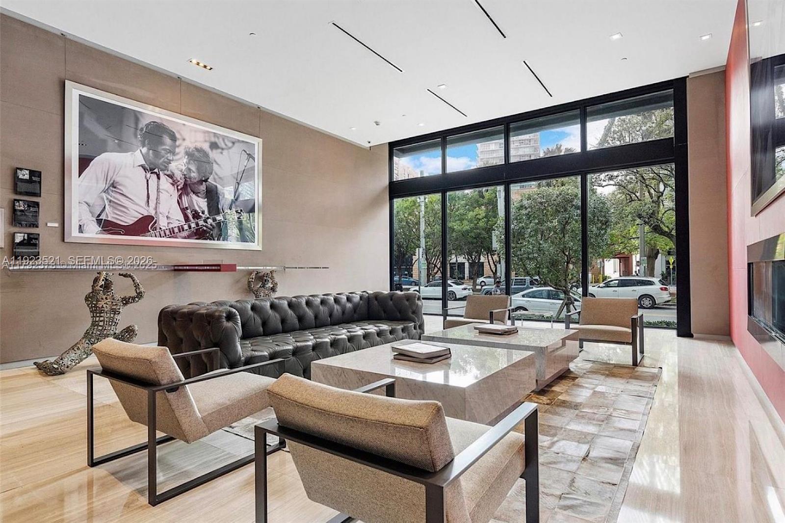 1080 Brickell Avenue, Unit 3602 Miami, FL 33131 - Photo 43 of 45 a living room with furniture and a large window