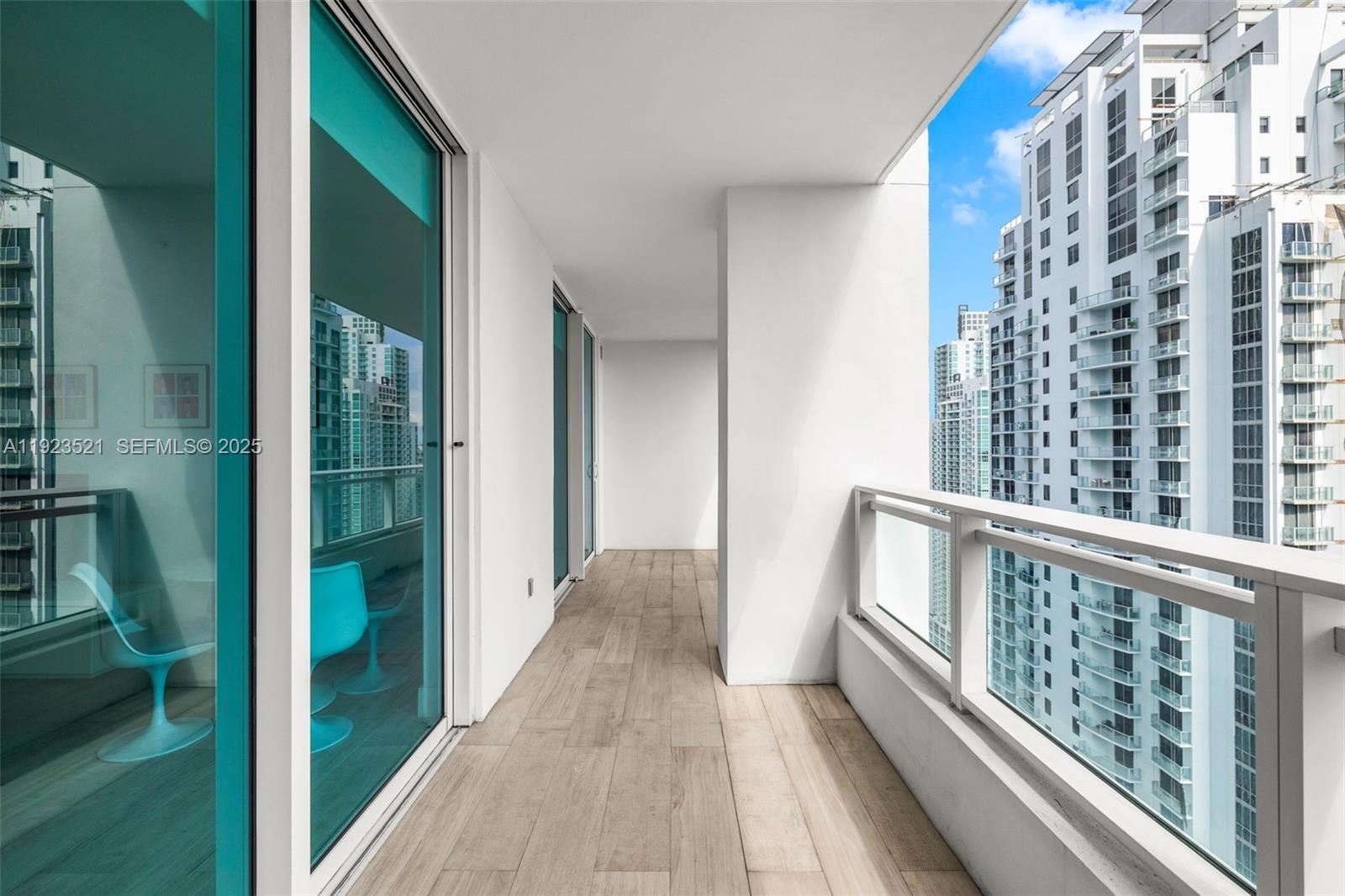 1080 Brickell Avenue, Unit 3602 Miami, FL 33131 - Photo 9 of 45 a view of balcony with wooden floor
