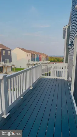 a view of a balcony with wooden floor
