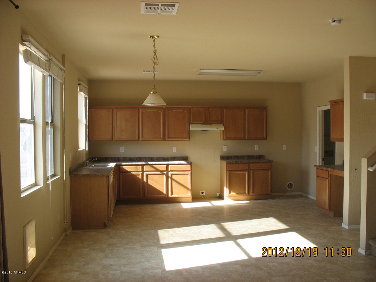 45571 West Guilder Avenue Maricopa, AZ 85139 - Photo 3 of 8 a view of a kitchen with a sink