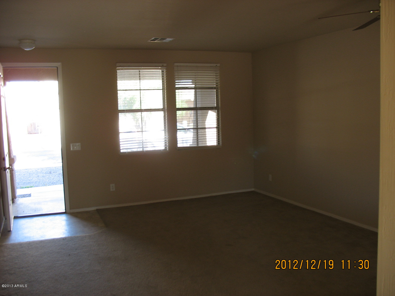 45571 West Guilder Avenue Maricopa, AZ 85139 - Photo 4 of 8 an empty room with a window