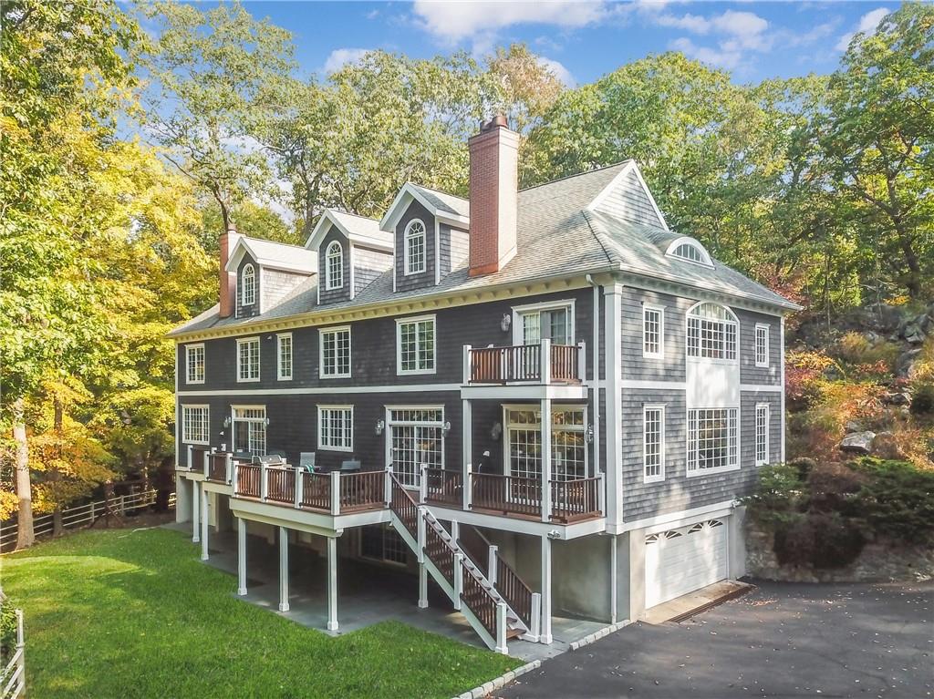 14 Tallwoods Road Armonk, NY 10504 - Photo 1 of 1 a view of a house with a yard and sitting area