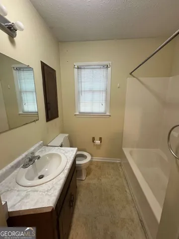 a bathroom with a sink and a bathtub