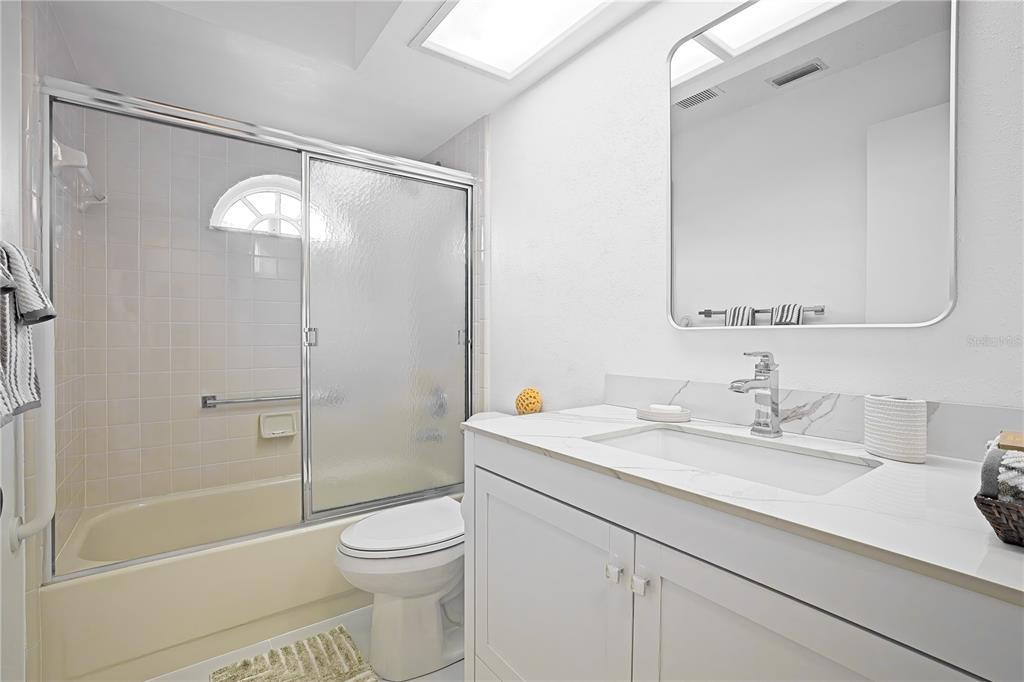 4658 Wallingford Court New Port Richey, FL 34655 - Photo 18 of 48 a bathroom with a sink a toilet and shower