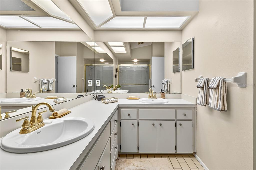 4658 Wallingford Court New Port Richey, FL 34655 - Photo 22 of 48 a bathroom with a sink double vanity and a mirror