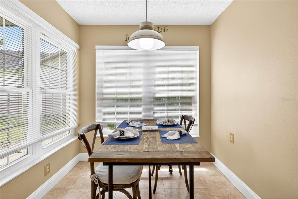 4658 Wallingford Court New Port Richey, FL 34655 - Photo 30 of 48 a view of a dining room with furniture window and outside view