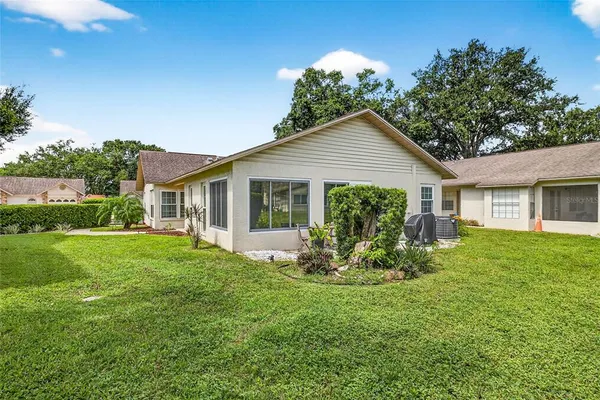 a view of a house with a yard
