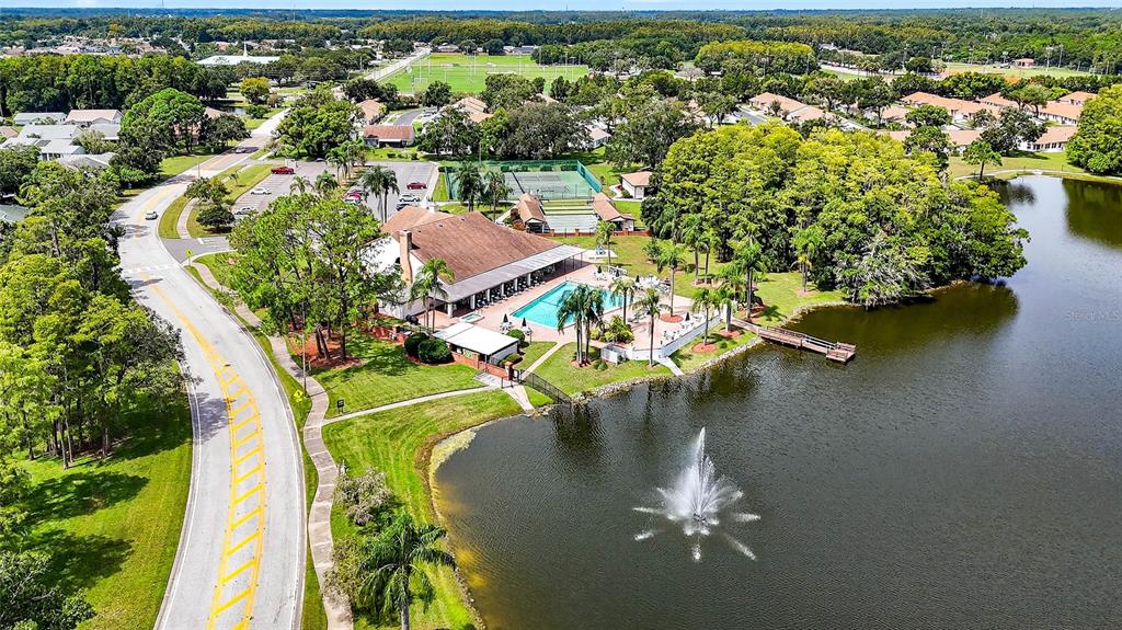 4658 Wallingford Court New Port Richey, FL 34655 - Photo 46 of 48 an aerial view of a house with a yard swimming pool outdoor seating and yard