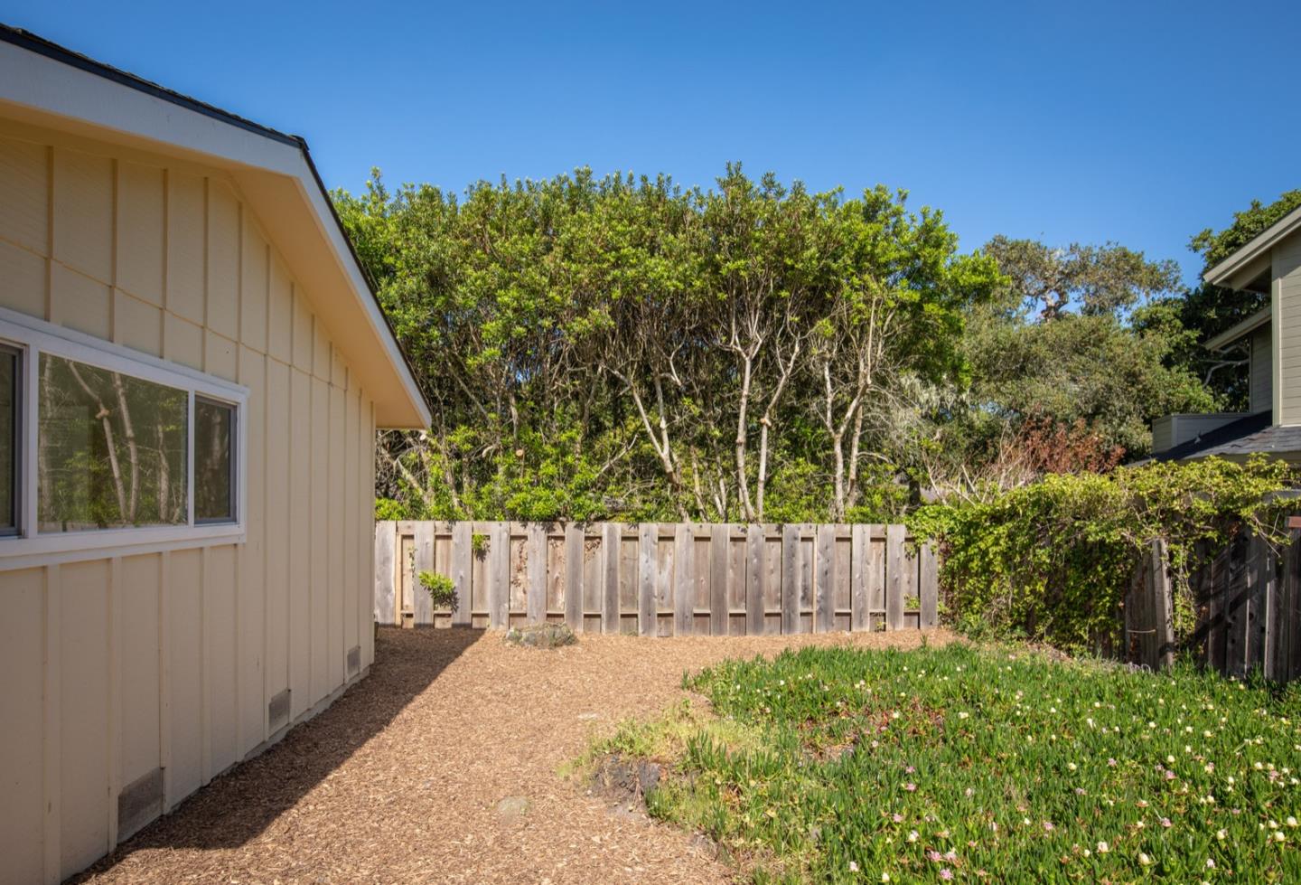 1043 Ocean Road Pebble Beach, CA 93953 - Photo 14 of 18 a backyard of a house