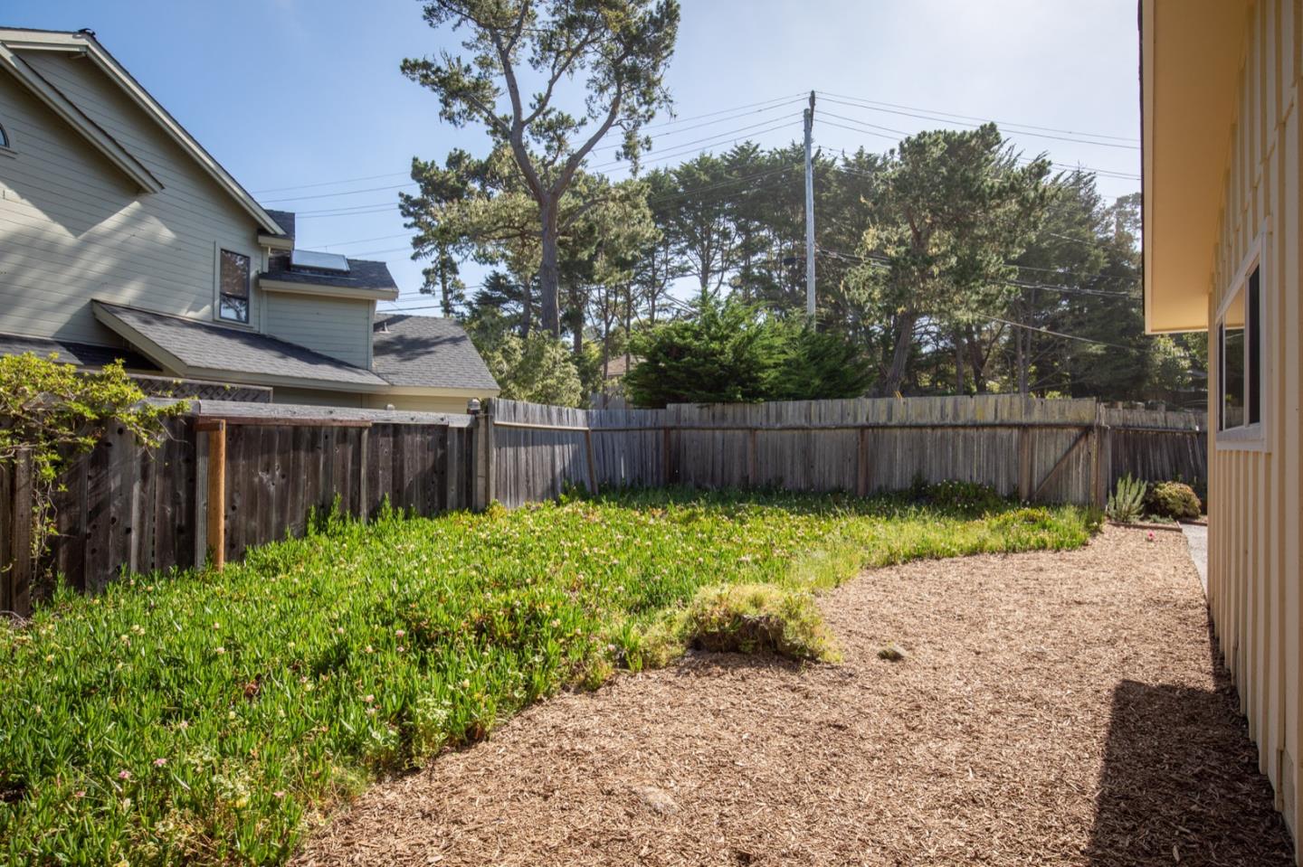 1043 Ocean Road Pebble Beach, CA 93953 - Photo 16 of 18 a view of backyard with green space